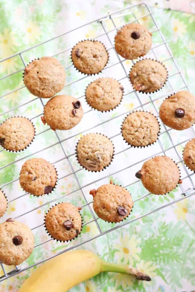 overhead view of vegan banana bread muffins on a wire cooling rack