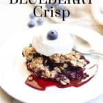 overhead photo of vegan blueberry crisp with text overlay for pinterest