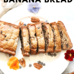 vegan banana bread sliced on a plate with text overlay for pinterest