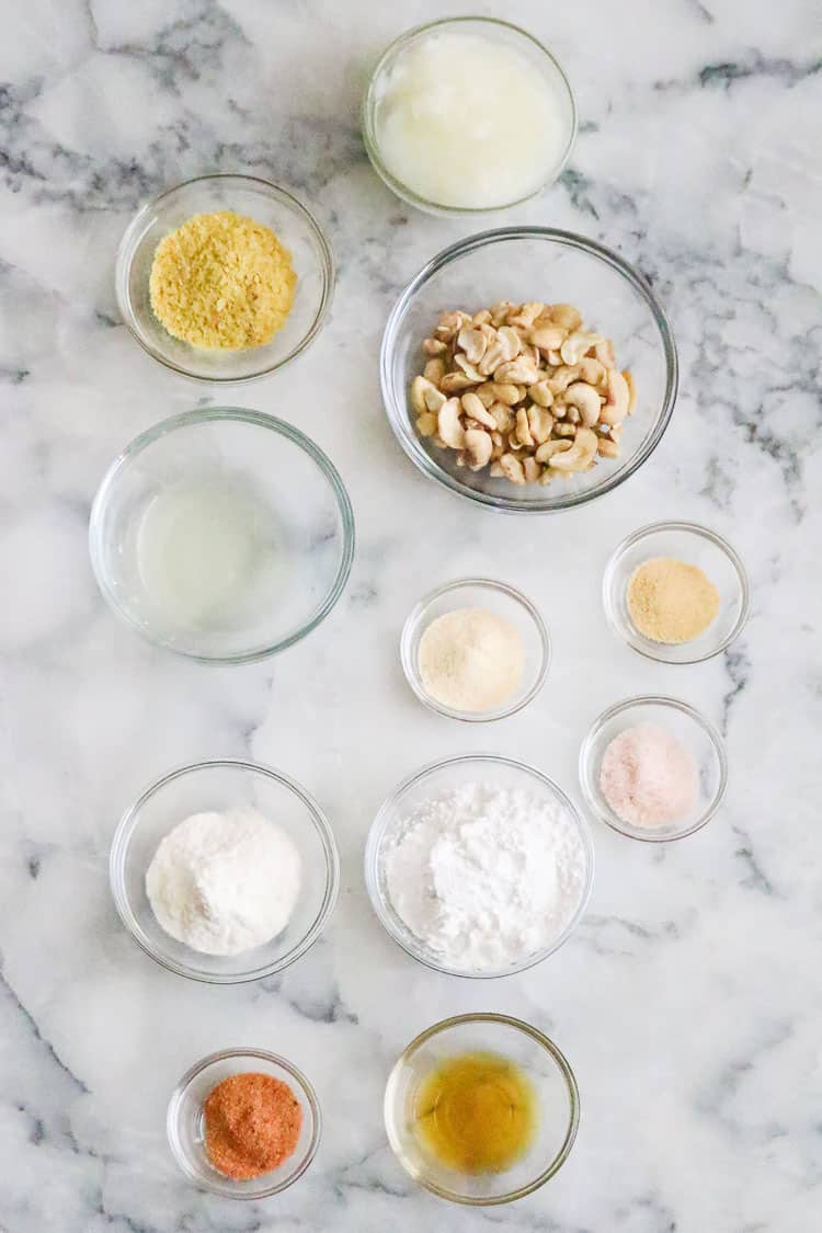 Overhead shot of ingredients for vegan smoked gouda in small clear bowls.