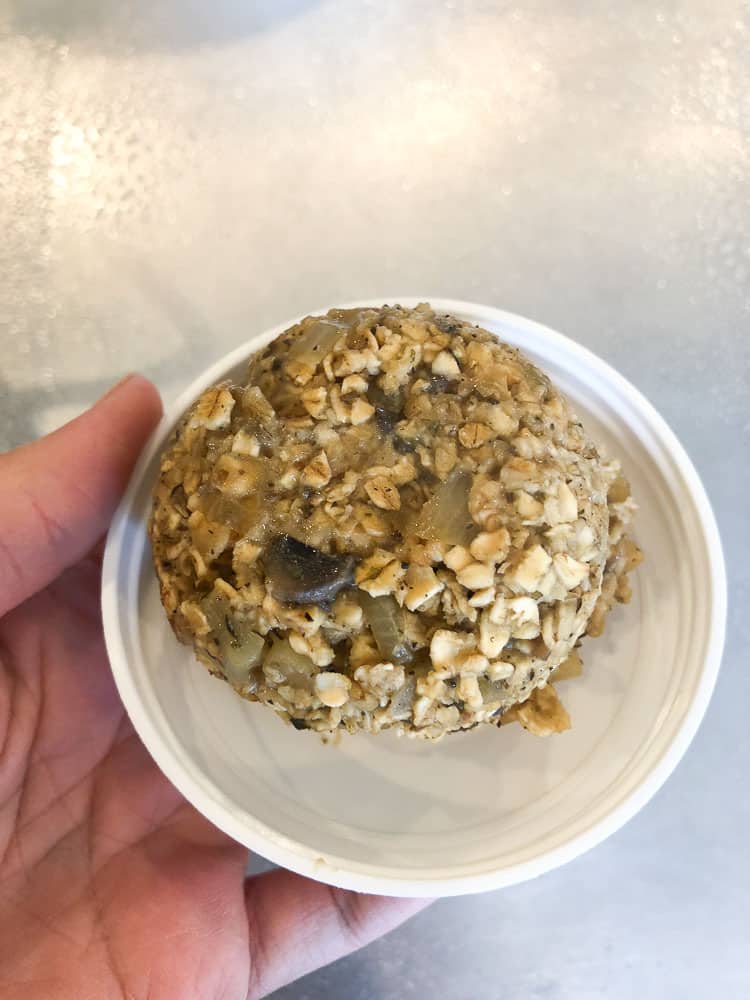 overhead shot showing vegan oatmeal burger mixture in white lid 