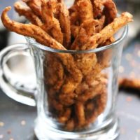 Side view of vegan jerky in a clear glass