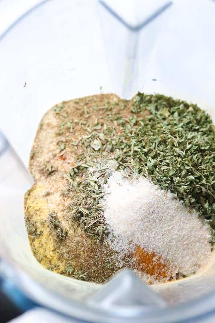 overhead photo of seasonings for vegan chicken-style broth in a blender