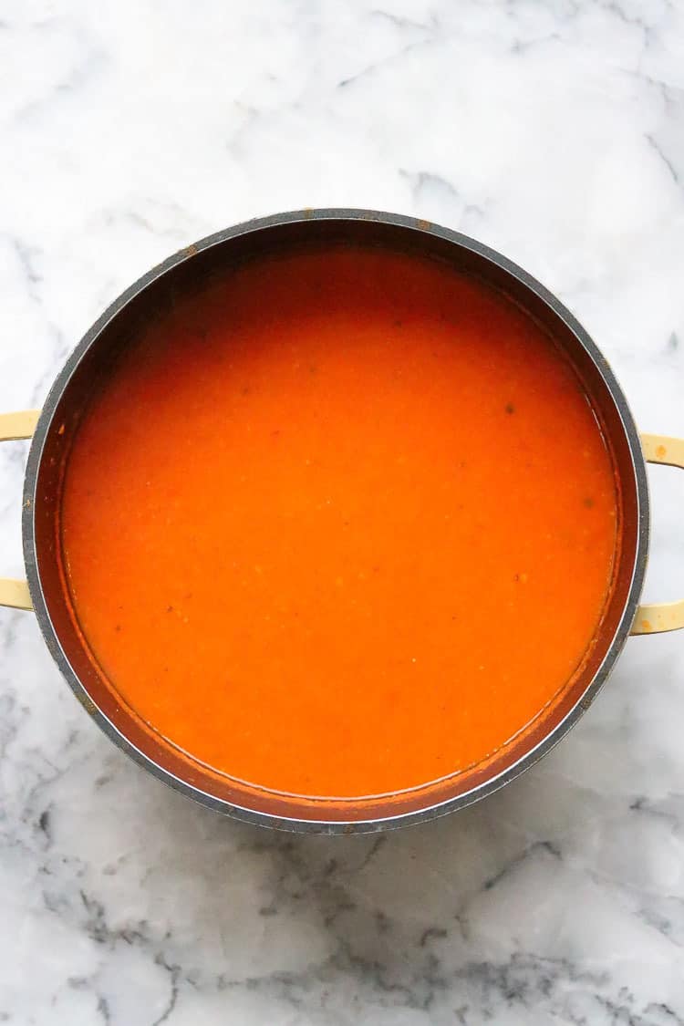 overhead shot of pureed tomato soup in a stockpot