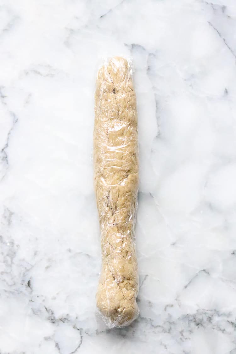 overhead shot of plastic-wrapped roll of vegan seitan