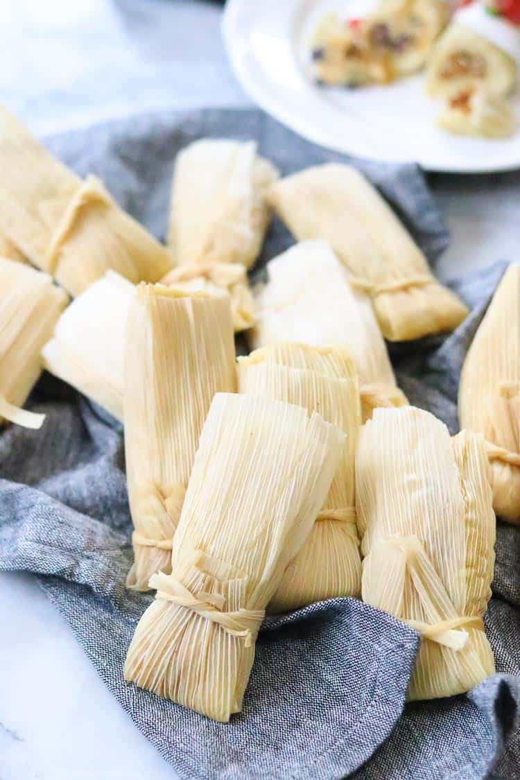 overhead shot of vegan tamales spread out on a napkin