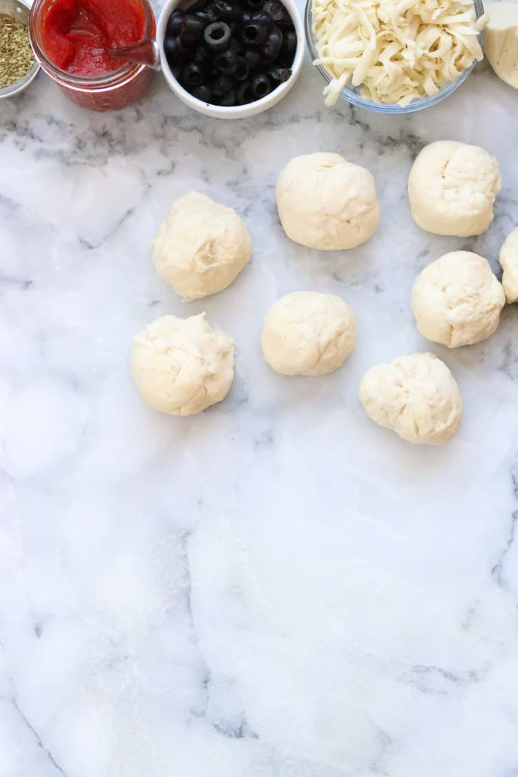 overhead shot of vegan calzone fillings and dough balls