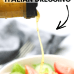 side shot of homemade Italian dressing being poured onto salad with text overlay