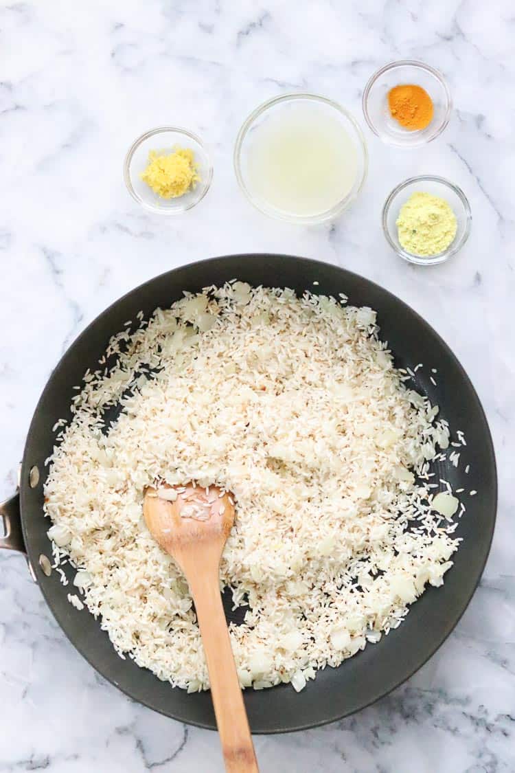 fried white rice grains for lemon rice recipe with other ingredients nearby