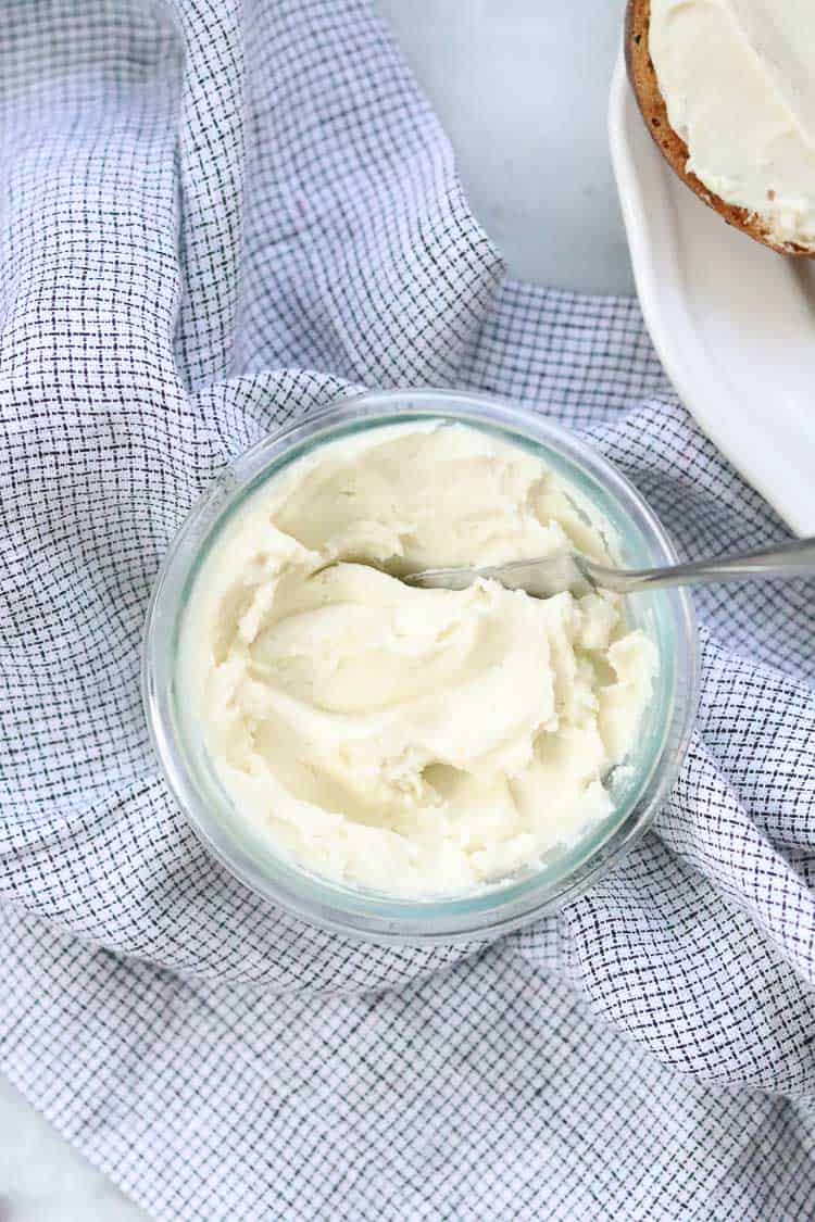 vegan cream cheese in a ramekin with napkin in background