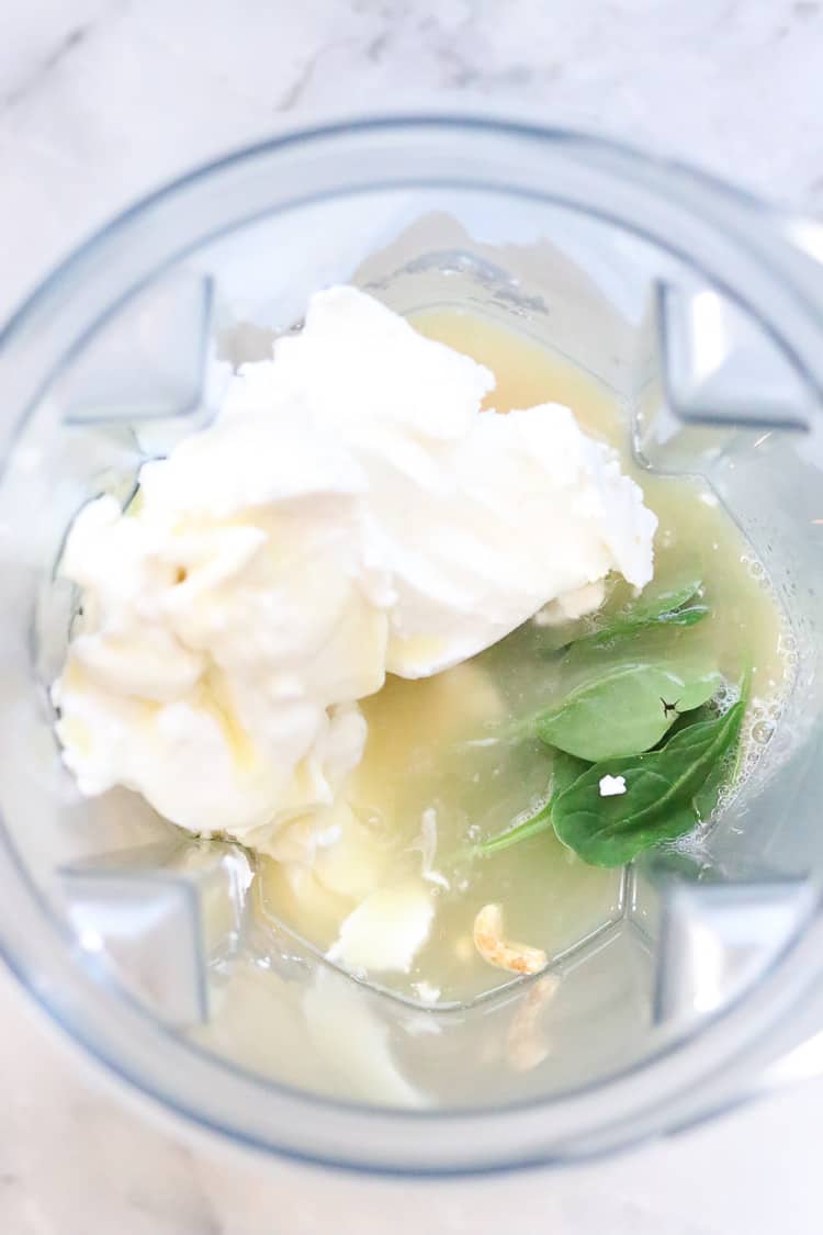 overhead shot of blender full of coconut milk cream and other ingredients for vegan key lime pie