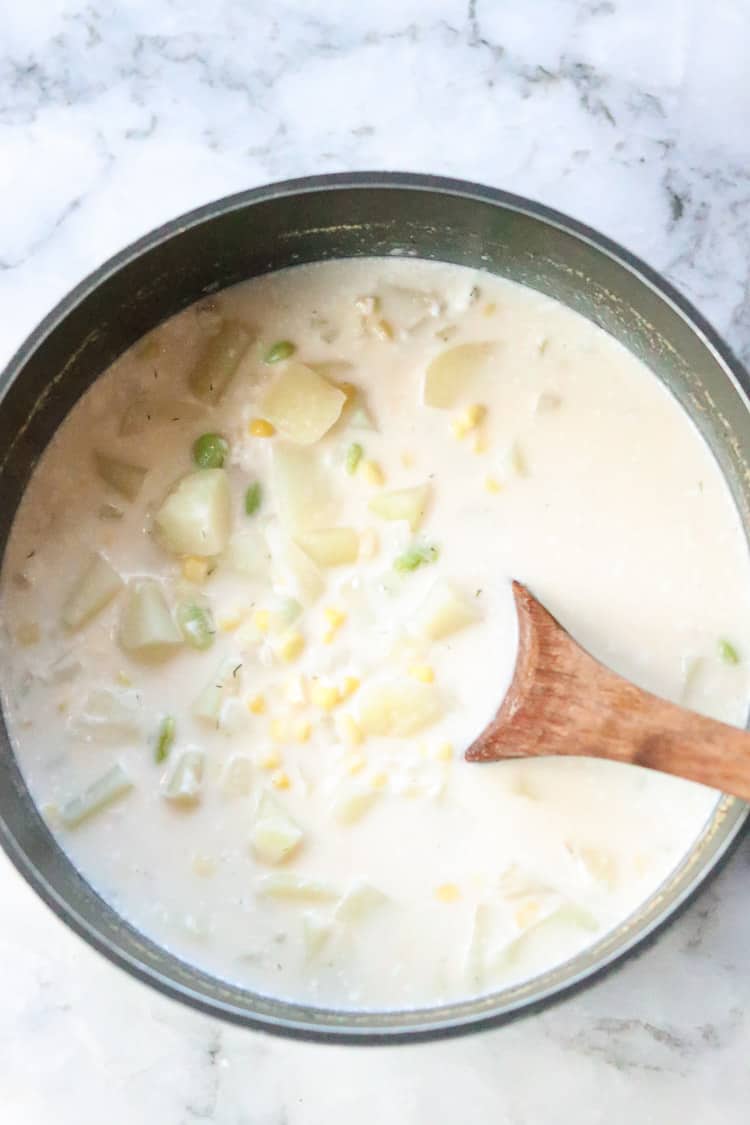 overhead shot of finished vegan corn chowder soup recipe in stock pot