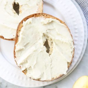 vegan cream cheese spread on 2 bagel halves