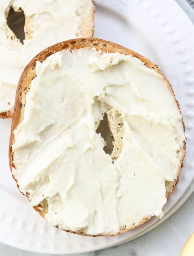 vegan cream cheese spread on 2 bagel halves