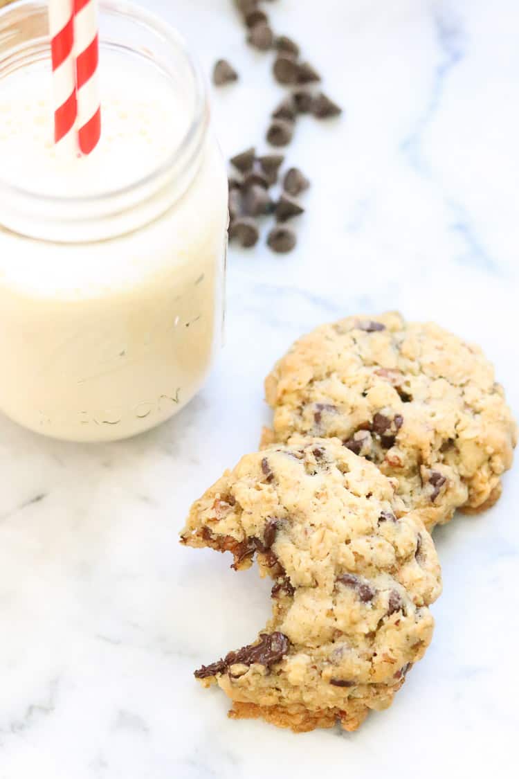 overhead shot of vegan oatmeal chocolate chip cookies resting on marble background