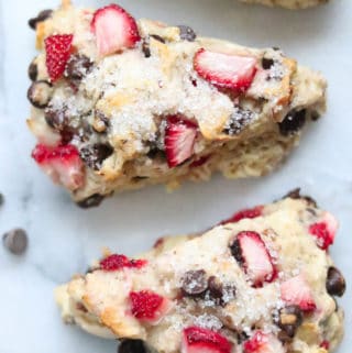 overhead closeup shot of vegan scones with strawberries and chocolate chips