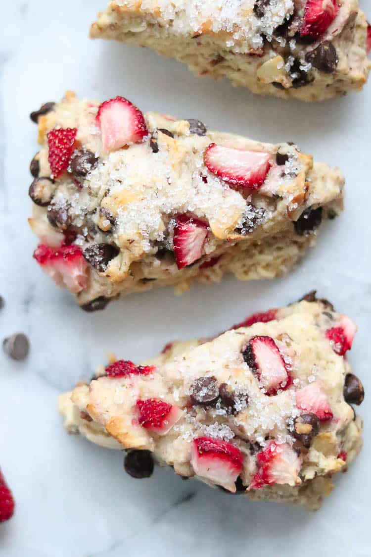 closeup overhead shot of 2 vegan scones with glazed sugar on top