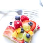 overhead closeup photo of a square slice of vegan fruit pizza