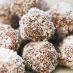 side shot of piled up vegan coconut balls