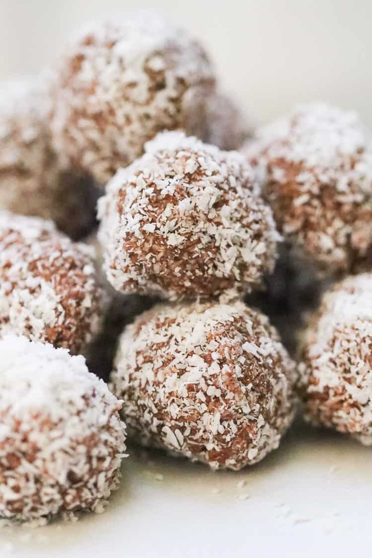 side closeup shot of stacked vegan coconut balls