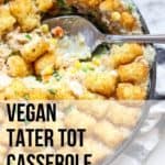 vegan tater tot casserole closeup with silver spoon and text overlay for pinterest