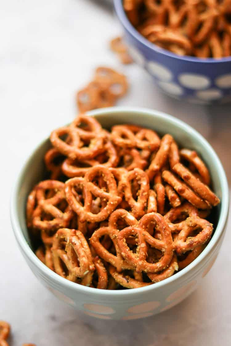 side overhead closeup shot show texture of seasoning of pretzel resting in a turquoise ceramic bowl