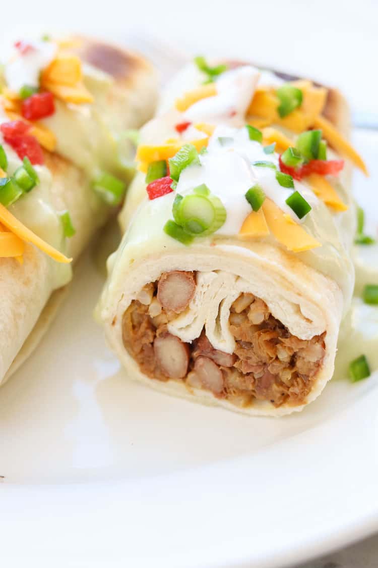 side closeup photo of sliced chimichanga showing filling inside