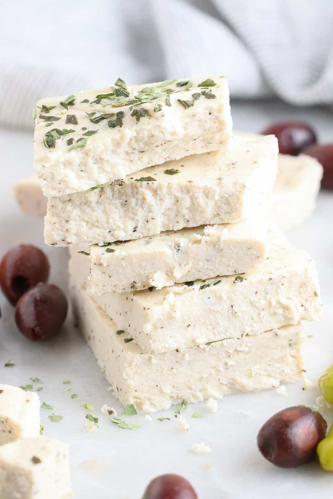 Stack of vegan feta cheese.