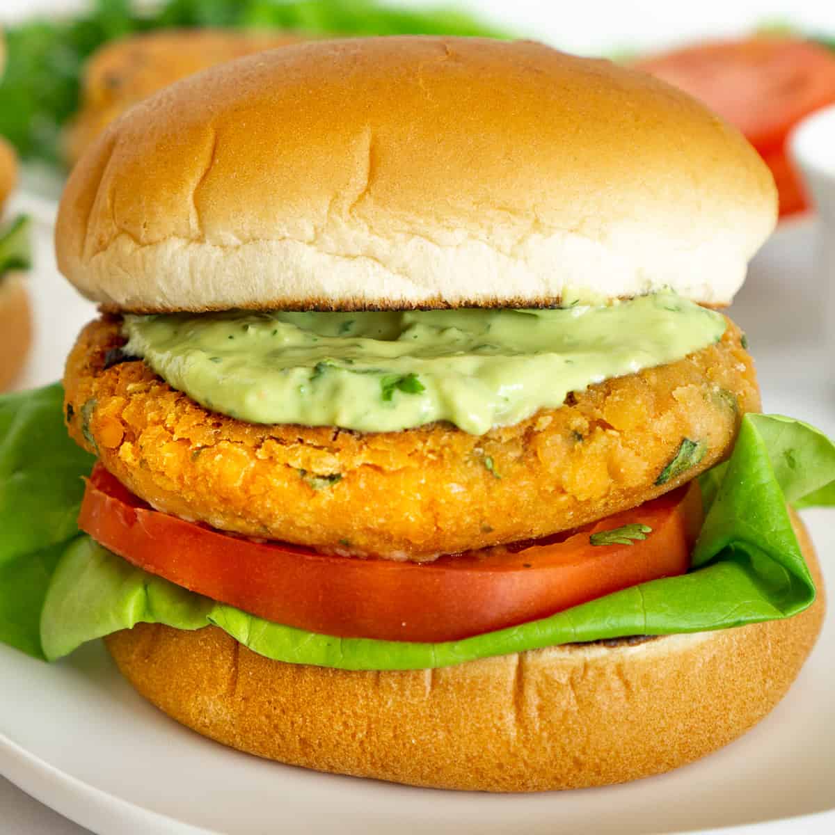 vegan lentil burger with creamy avocado sauce