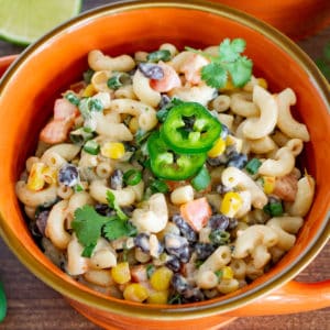 vegan mexican macaroni salad in a bowl garnished with jalapeno