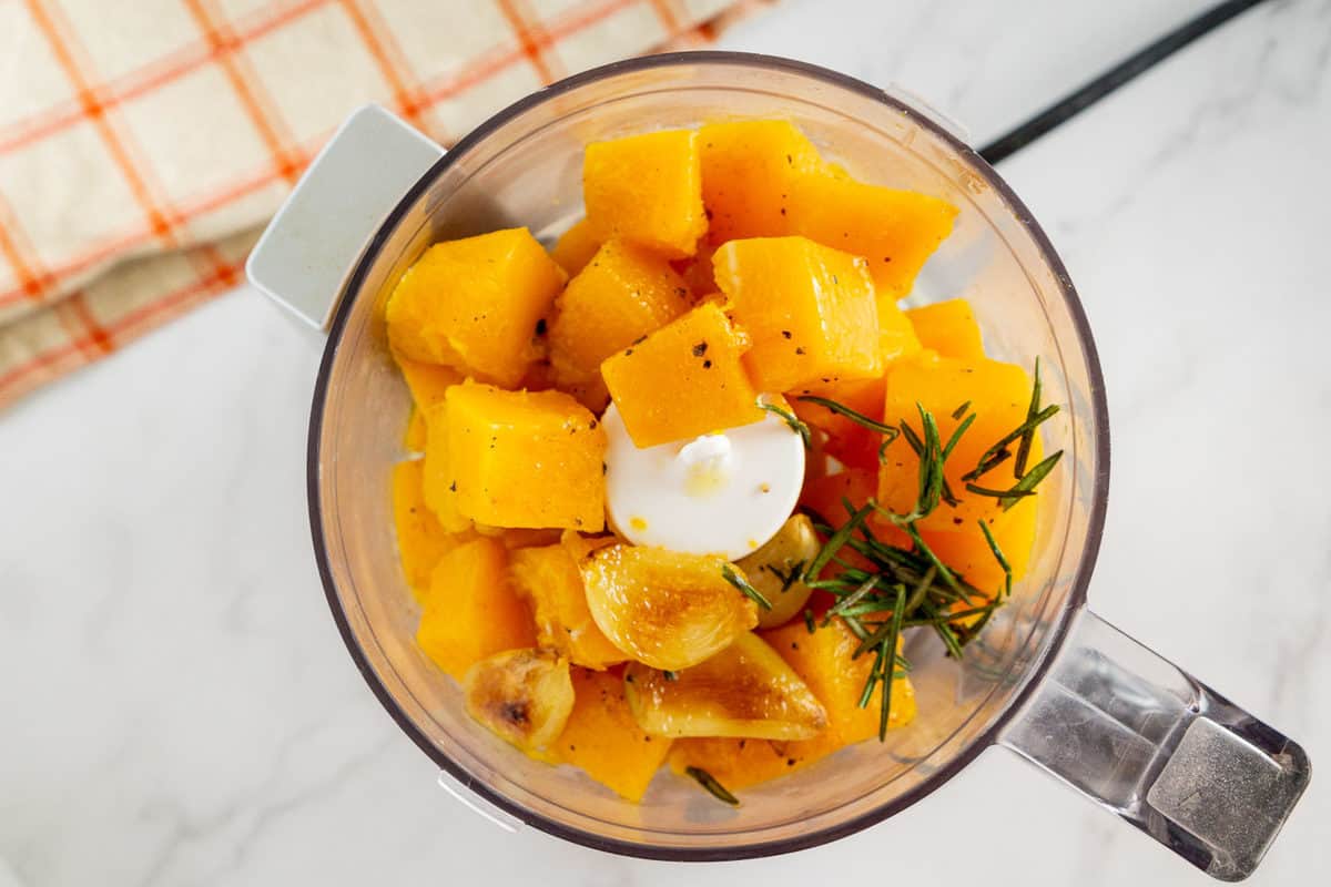 roasted butternut squash and roasted garlic in a food processor