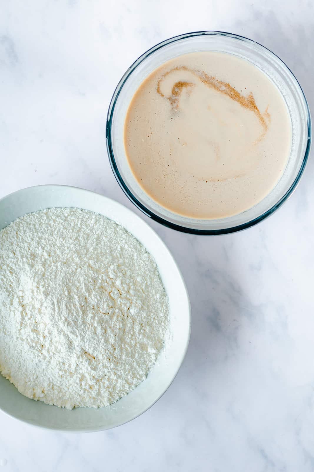 wet ingredients in a bowl and dry ingredients in a bowl for making vegan pancakes