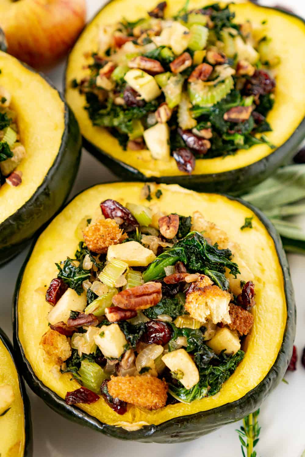 vegan stuffed acorn squash on a platter