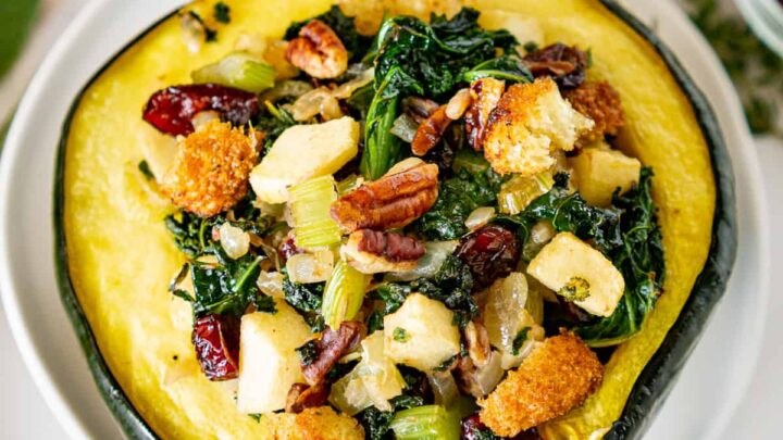 halved stuffed acorn squash on a plate