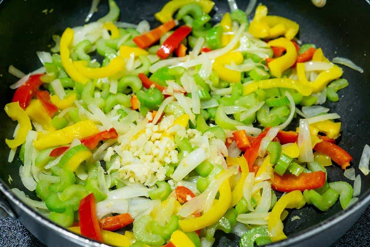 bell peppers, celery, and cashews stir fried in a skillet