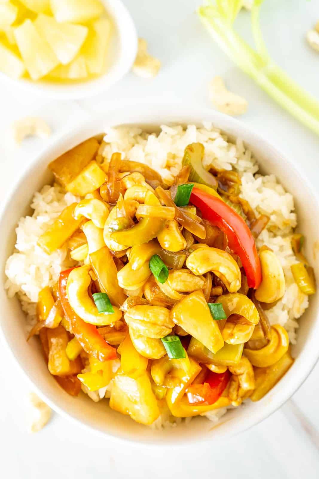 bowl of vegan cashew celery stir fry with pineapple