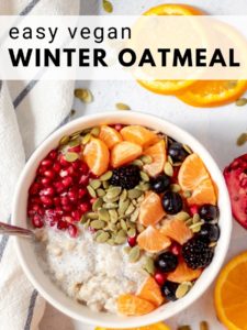 bowl of vegan oatmeal with pomegranate and fruit