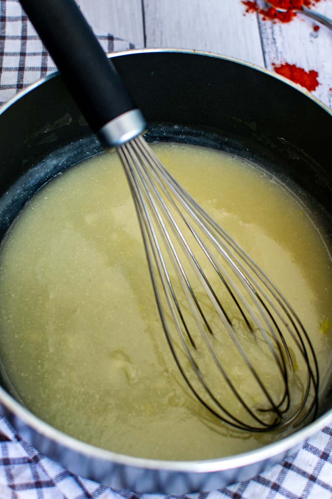 dairy free vegan garlic sauce whisked in a pan