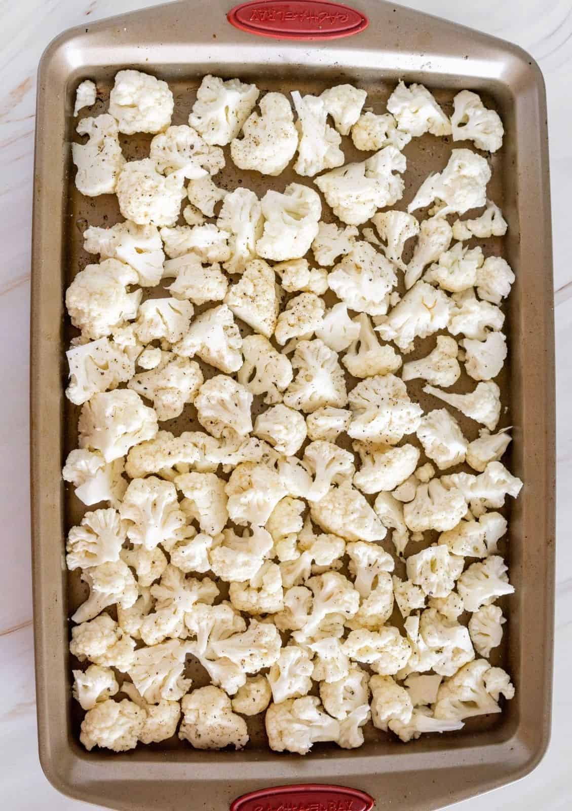 roasted cauliflower florets on a baking sheet
