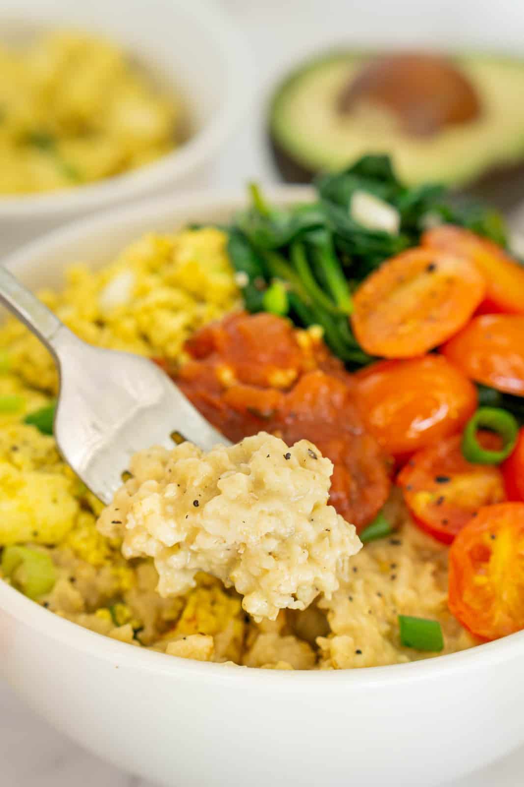 Fork holding savory oatmeal.