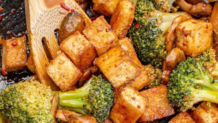 Broccoli and tofu stir fry in a wok.