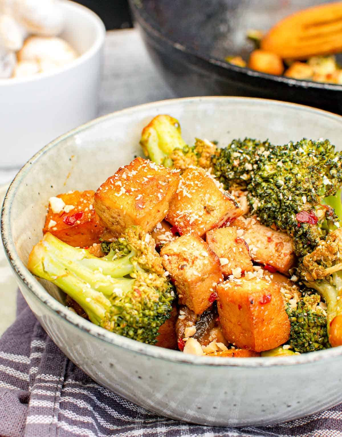 Broccoli tofu mushroom stir fry in a bowl.