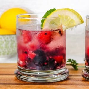 Glass of berry spritzer drink.
