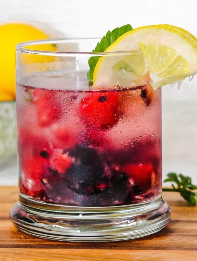 Glass of berry spritzer drink.