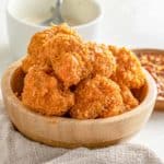 Bowl of crispy vegan Buffalo tofu nuggets.
