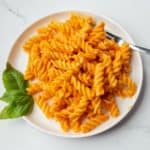 Plate of pasta with vegan roasted red pepper sauce.
