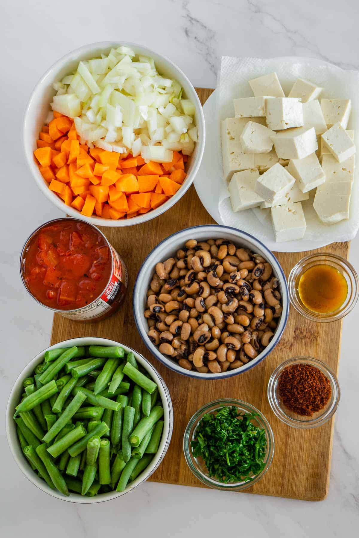 Ingredients to make vegan protein bowls with black eyed peas, tofu, and green beans.