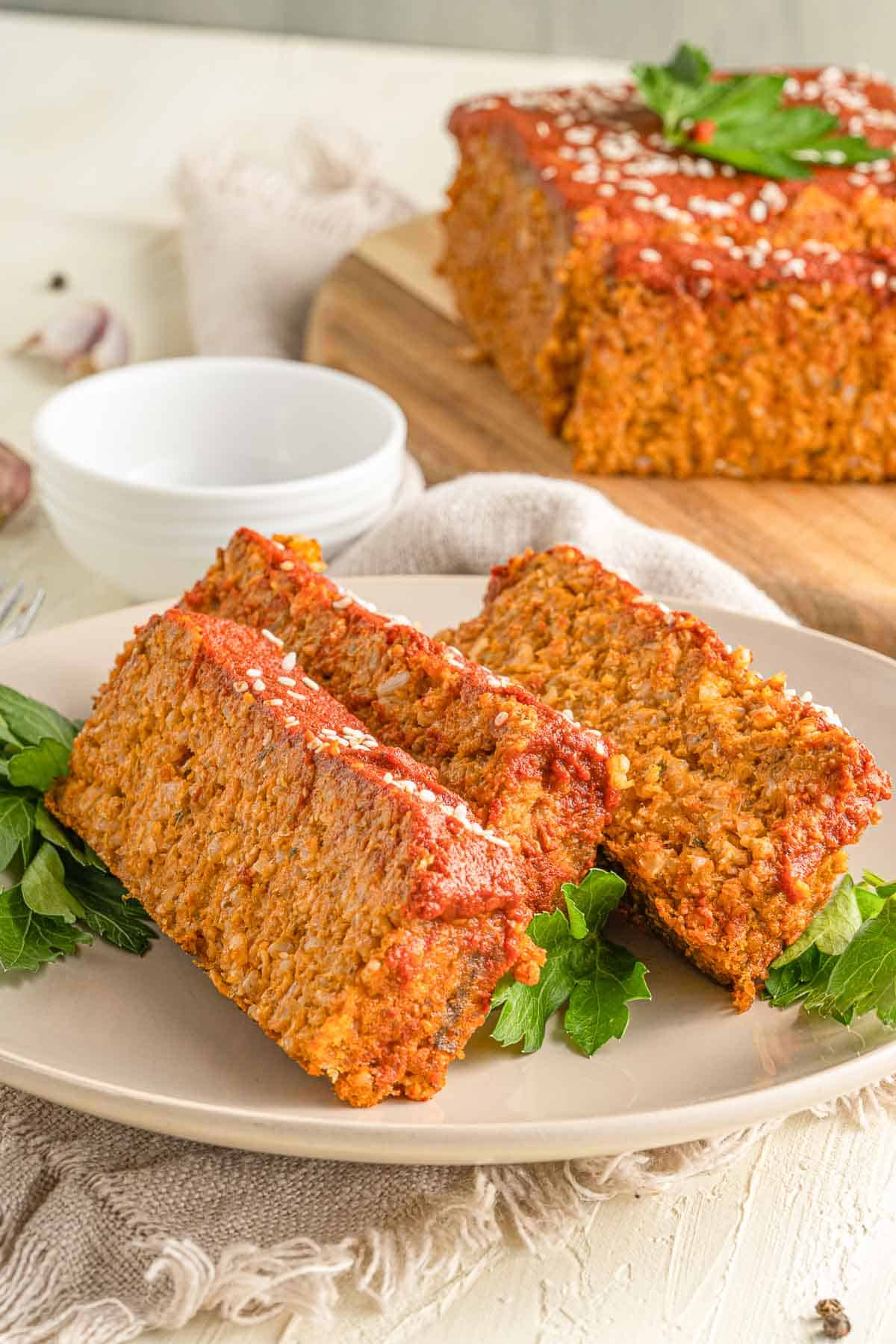 Slices of vegan rice loaf on a plate.