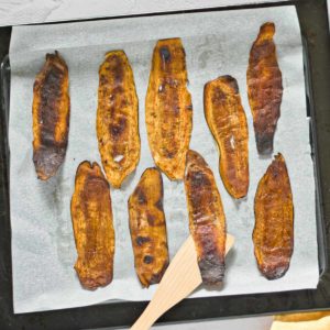 Crispy soy-free eggplant bacon on a baking pan