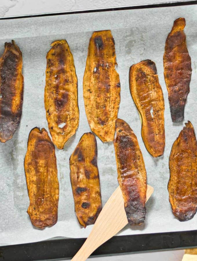 Crispy soy-free eggplant bacon on a baking pan